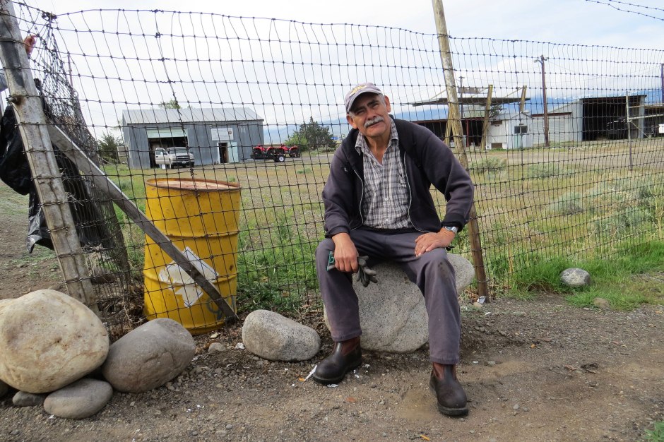 As the other laborers chat around him, Sergio quietly waits for work to come.