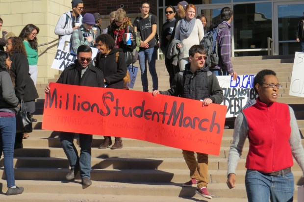 This banner at UNR states the three goals of the Million Student March: Tuition free college, the cancellation of student debt and a $15 per hour minimum student worker wage. Photo by Natalie Van Hoozer.
